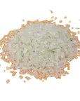 Close-up of dry off-white rice flakes for dogs