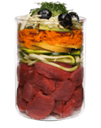Terra Canis diabetic dog food layers showing raw meat, zucchini, squash, carrots, cheese and blueberries